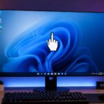 Windows 11 desktop screen displaying a custom middle finger mouse cursor